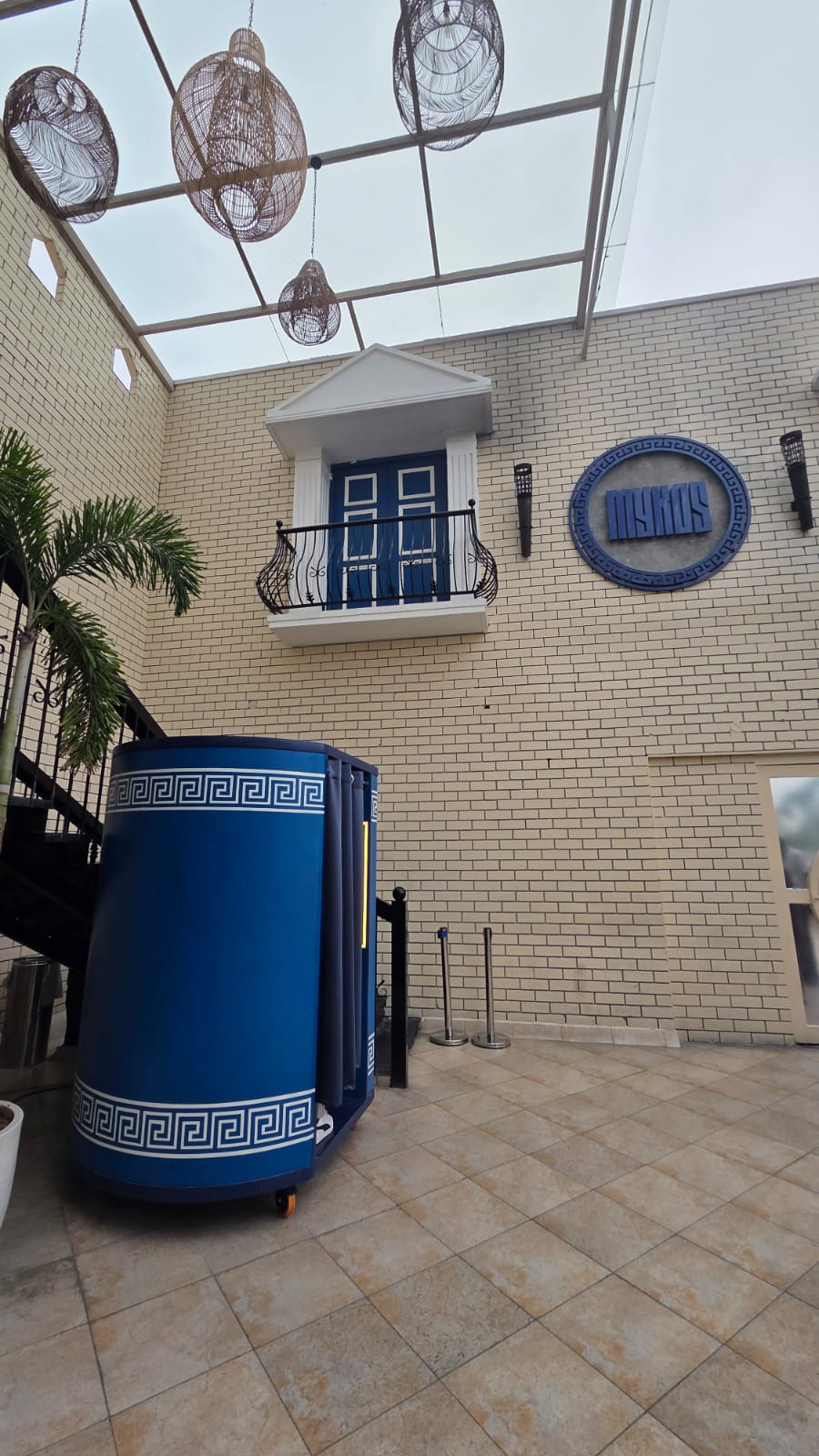 A Piczoo booth designed to match its venue — cobalt with Greek-key detail.