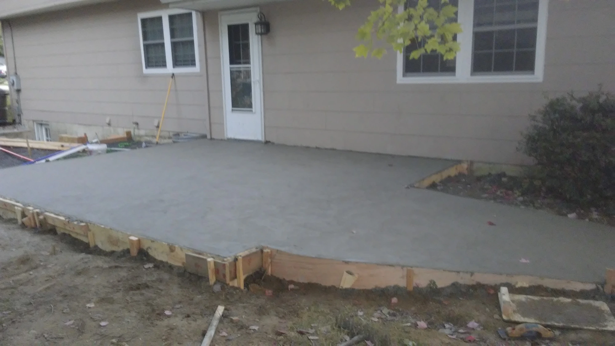 New finished concrete patio by back door