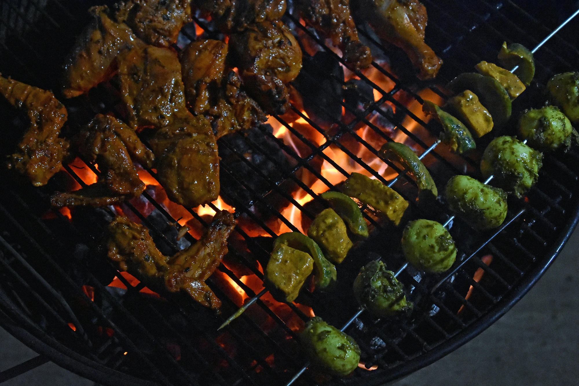 Kebabs on the grill, well after dark