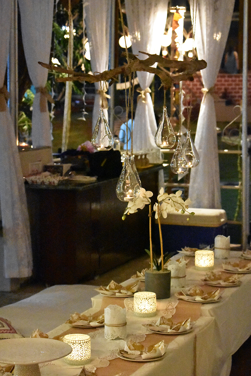 A candlelit dinner setup on the lawn
