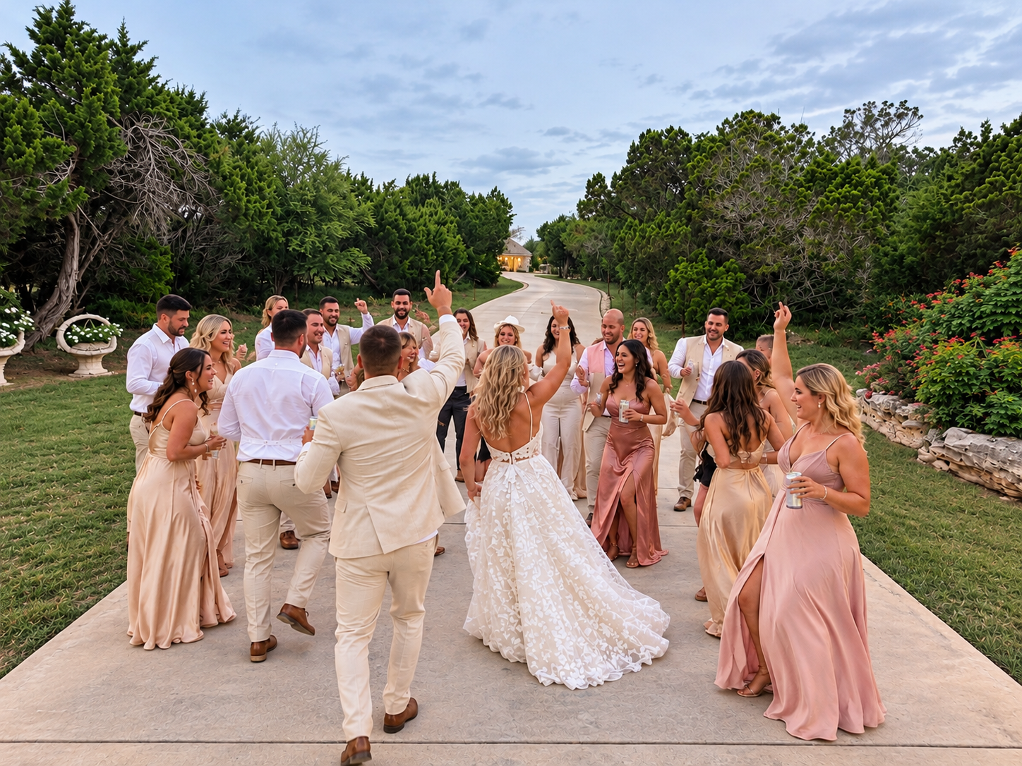 Wedding party celebrating on the drive